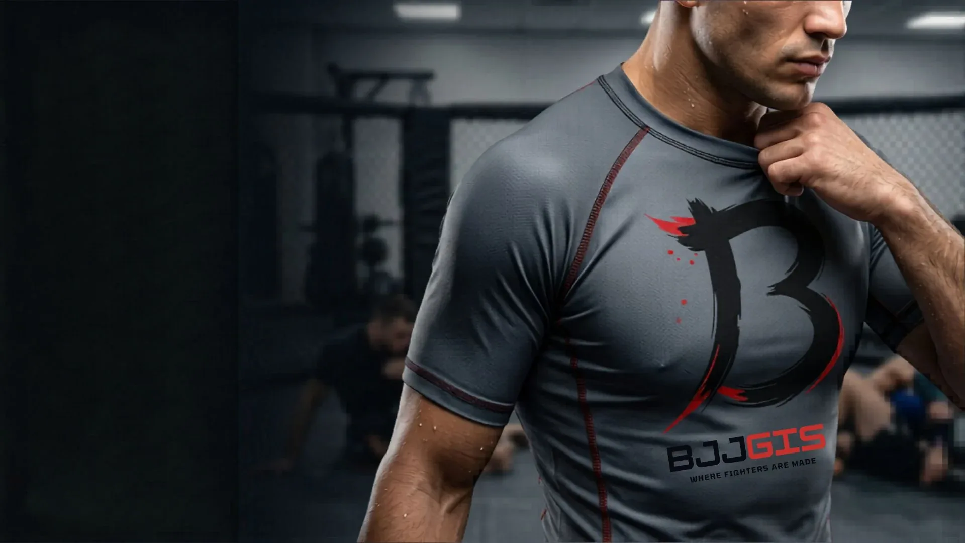 Athlete wearing a grey short sleeve BJJ Gis rash guard in the gym