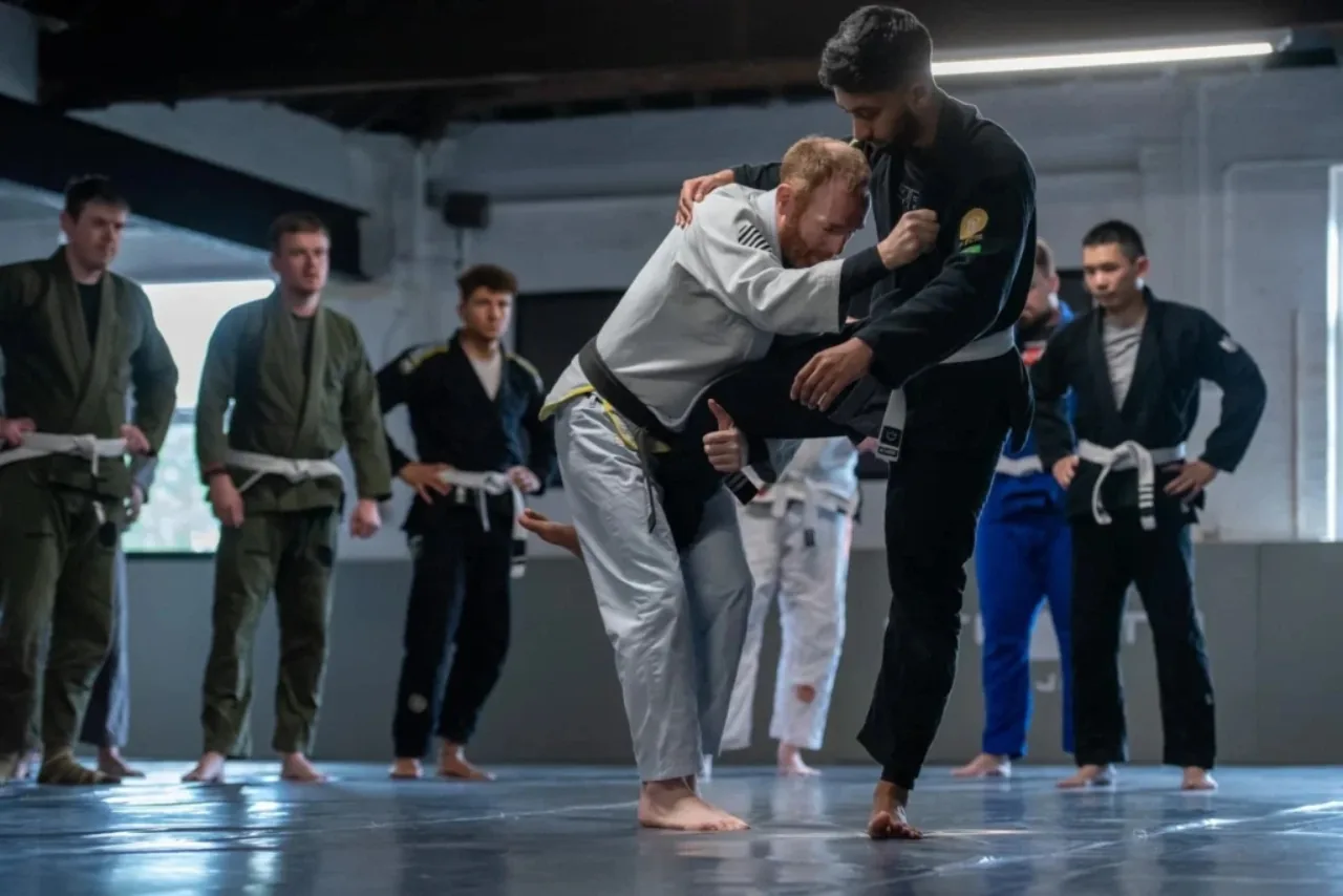 BJJ class training in gis at an academy