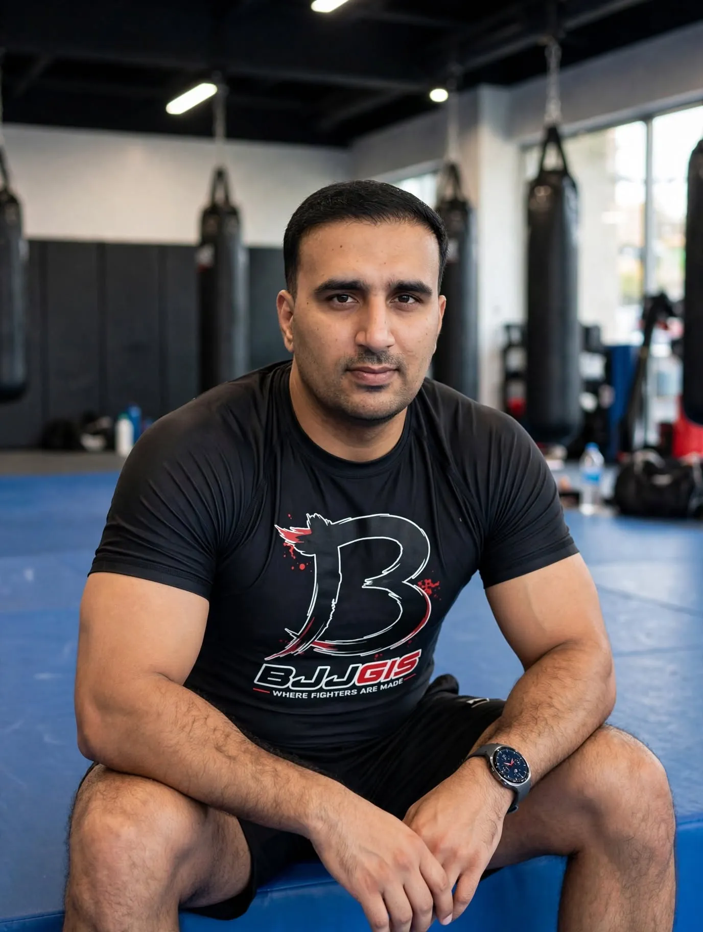 Man wearing a grey and blue private label rash guard