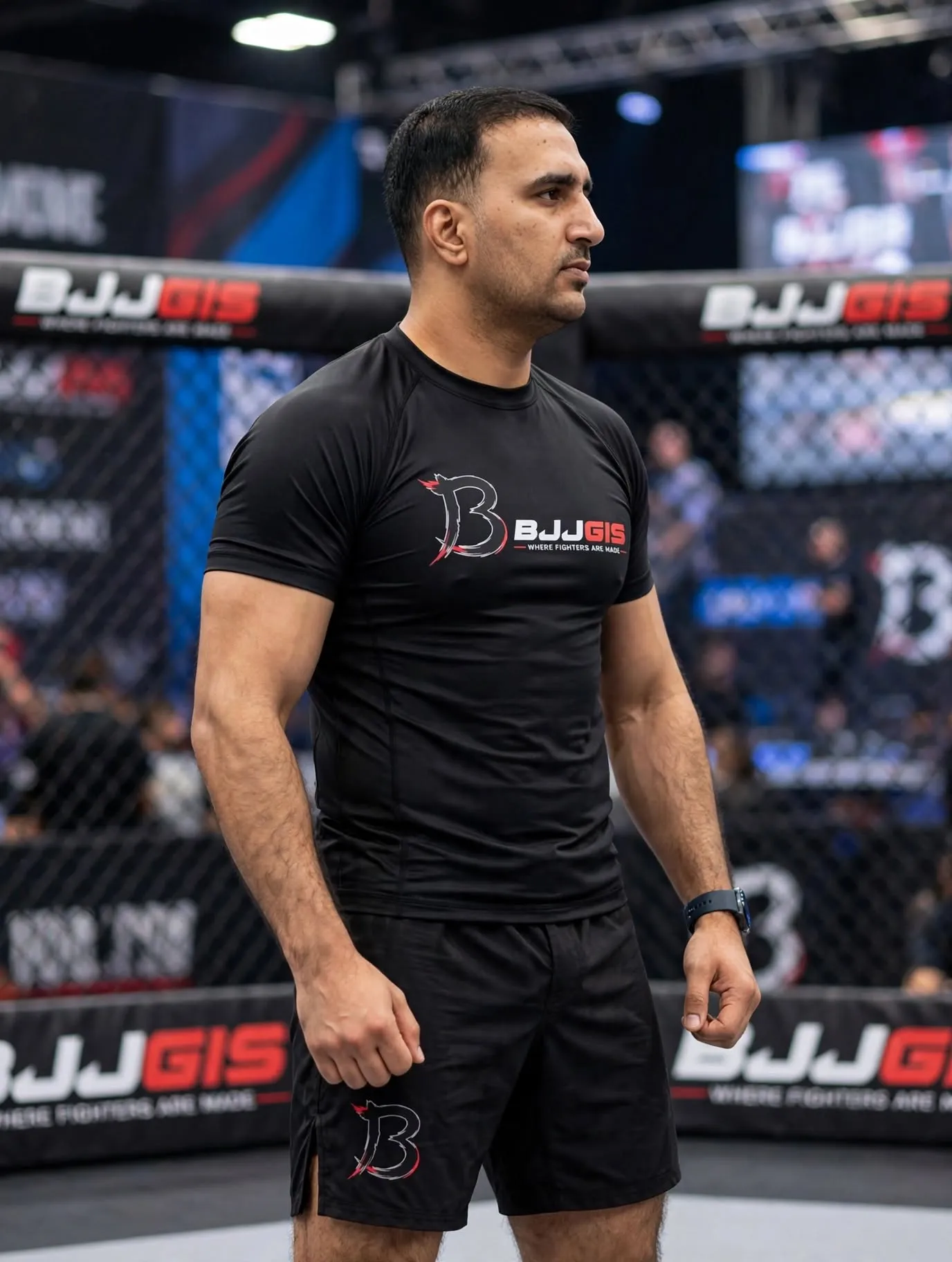 Athlete wearing a grey and blue no-gi rash guard