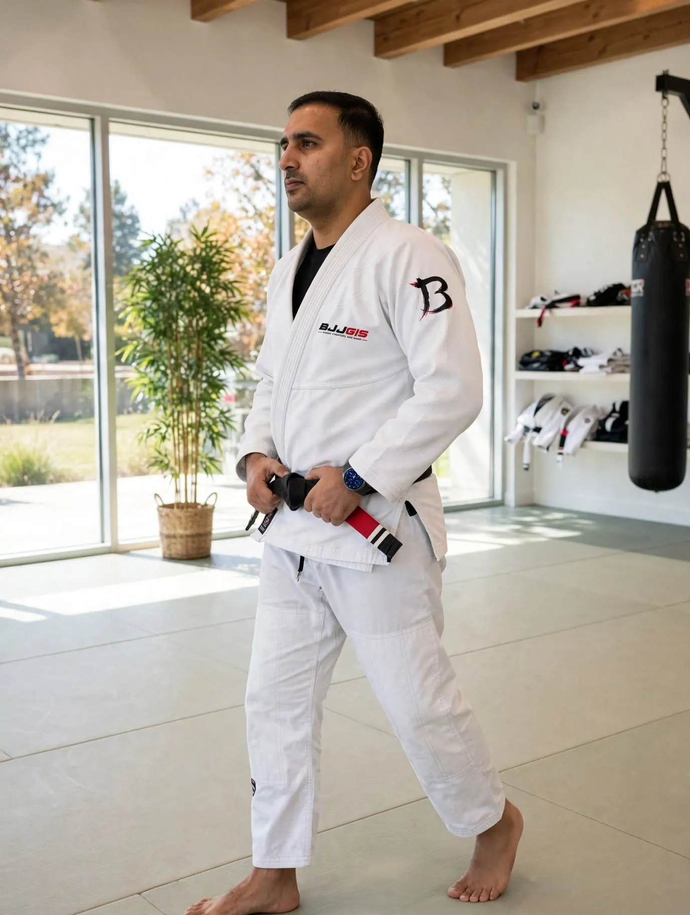 Athlete posing in a blue BJJ Gi
