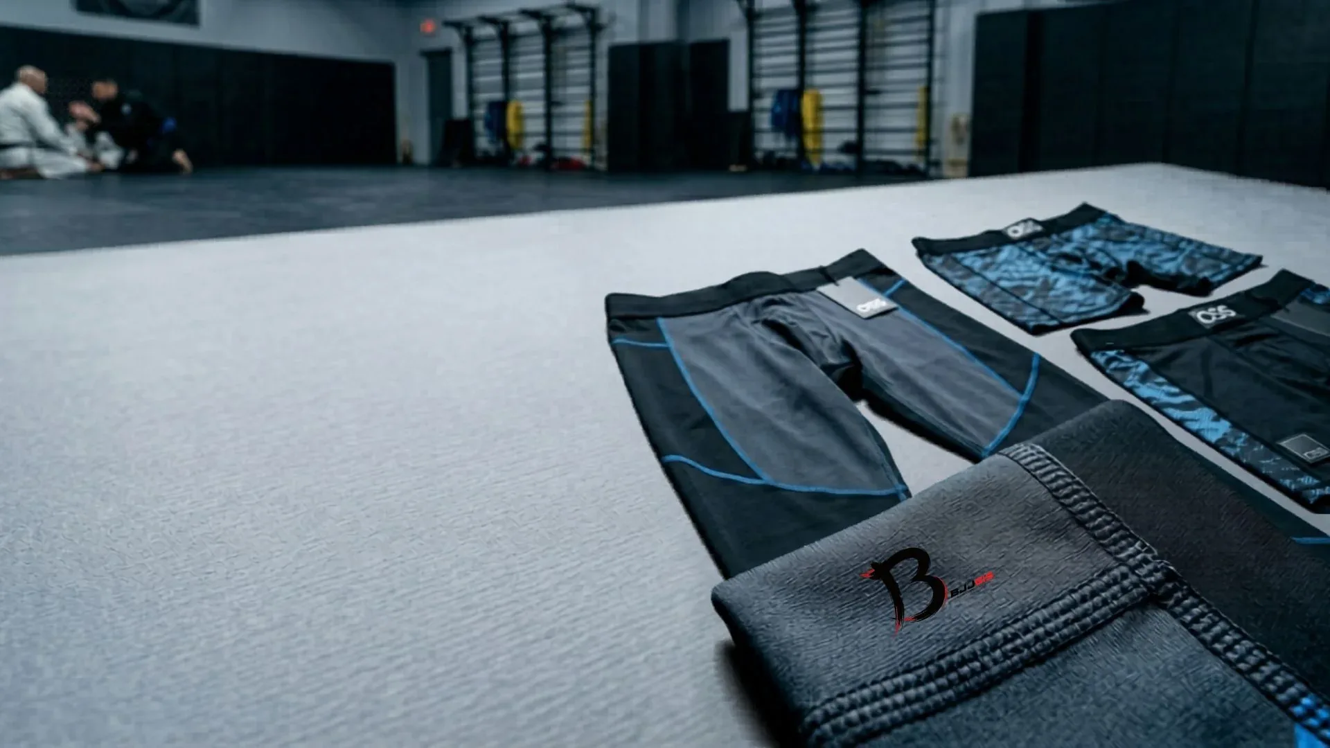 Compression shorts and spats laid out on training mats