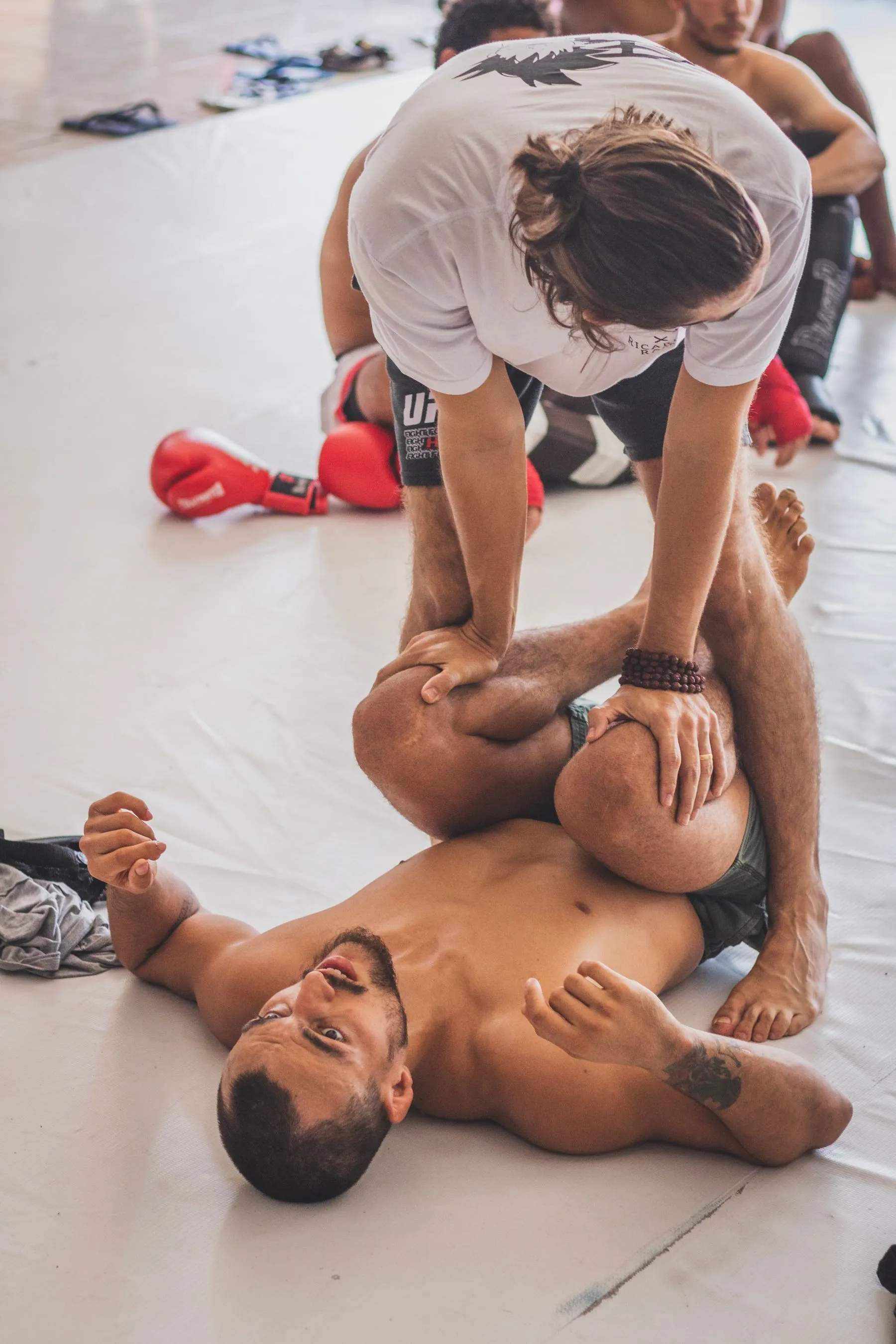 Two athletes grappling in Gis at the gym