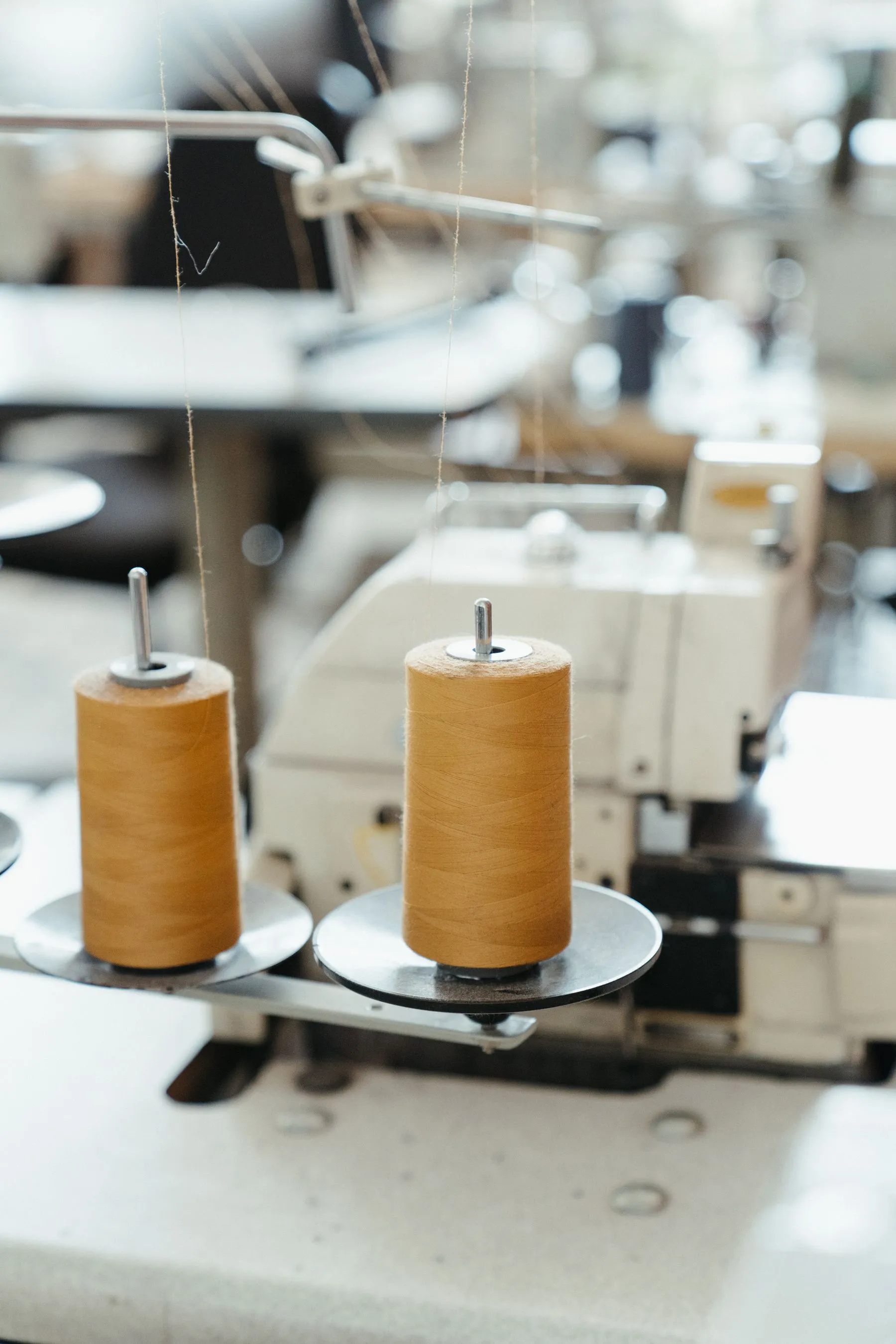 Industrial sewing machine with thread spools
